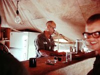 Al Zahorian tends the Officer's Club bar with and Ken Boone visible on right